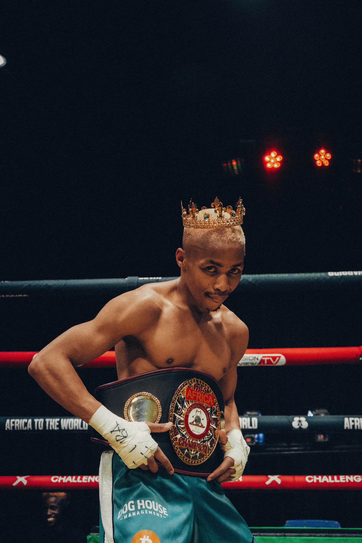 Mpendulo Msimanga wearing the WBA Africa championship belt and a crown in the Black Flag ring