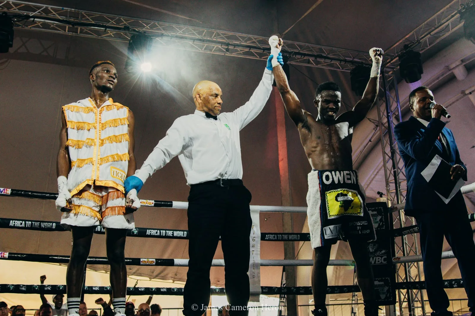 A referee raises a boxer's hand in a Warrior Ascent promotion archive photograph